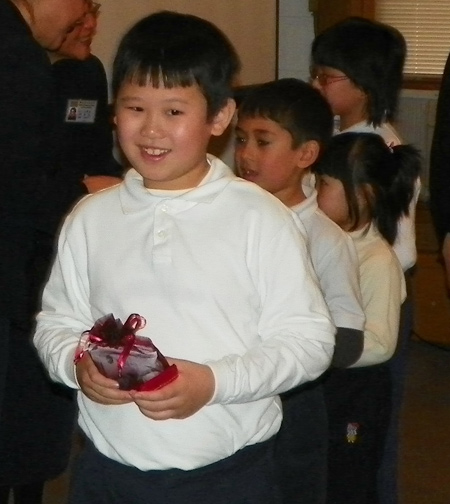 Buddhist boy receives gift