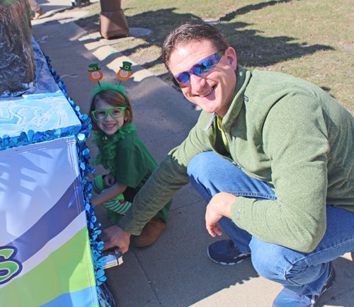 Young helper working on the float