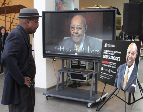 Kevin Conwell looking at Lou Stokes video