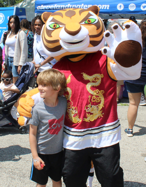 Tiger mascot and boy