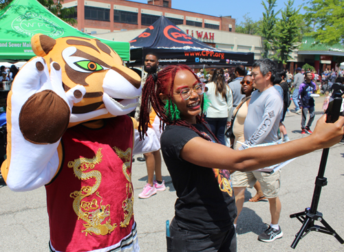 Crowd at Cleveland Asian Festival with tiger mascot
