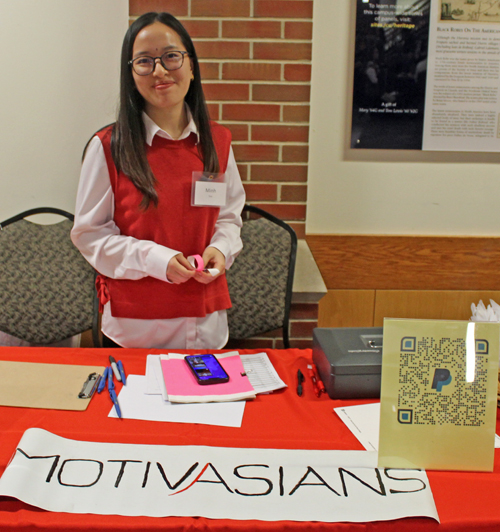 Volunteer at the MotivAsians signin table