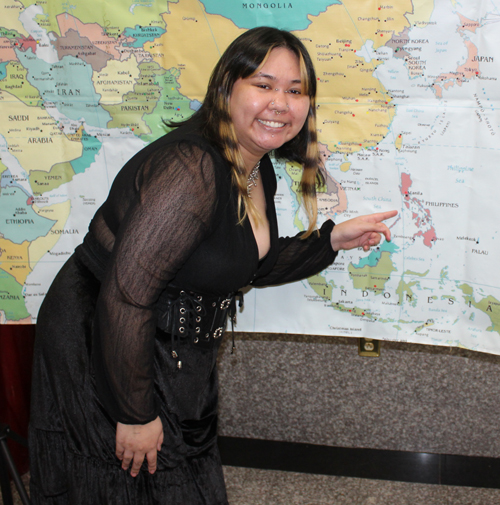 Pointing to the map of the Philippines