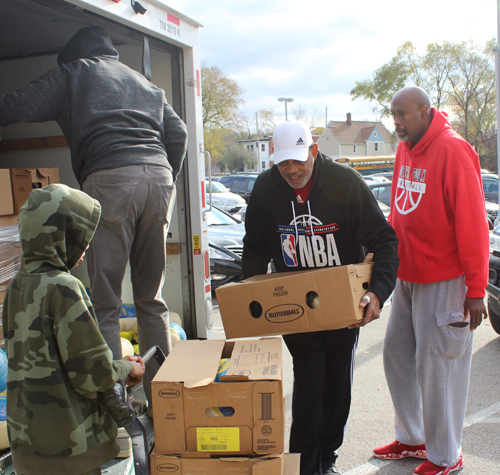 Campy Russell, Lawrence Boston and Derick Polk unloading turkeys