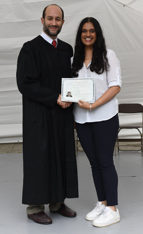 New citizens with Judge at Naturalization Ceremony at One World Day