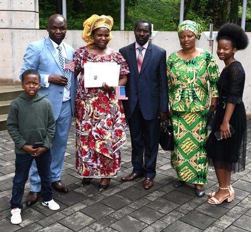 New citizens with Judge at Naturalization Ceremony at One World Day