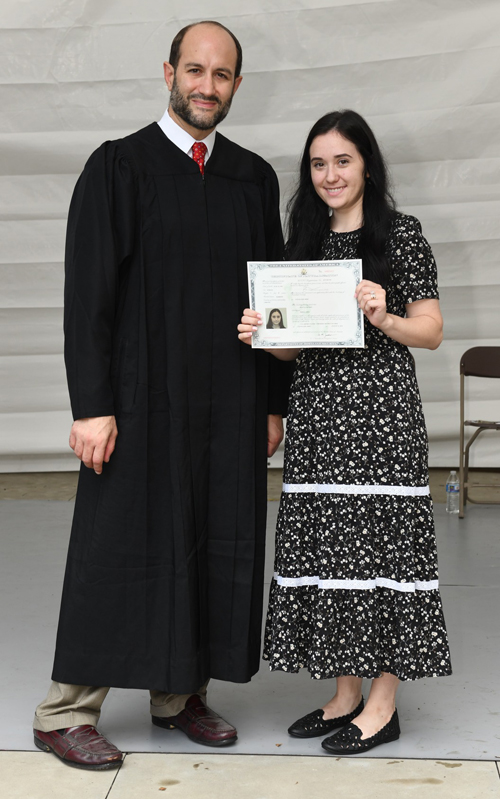 New citizens with Judge at Naturalization Ceremony at One World Day