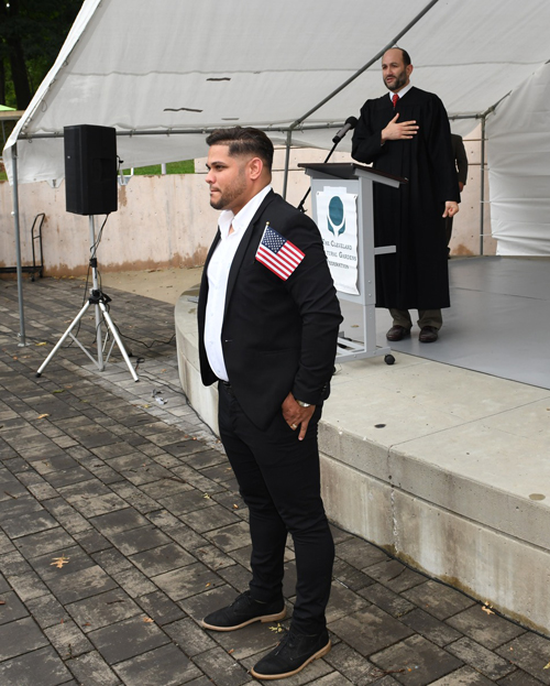 New citizens with Judge at Naturalization Ceremony at One World Day