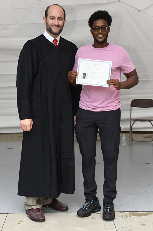 New citizens with Judge at Naturalization Ceremony at One World Day