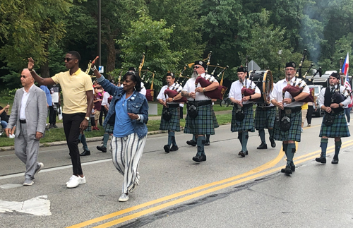 Dr. Wael Khoury and Mayor Justin Bibb and IACES Pipe Band