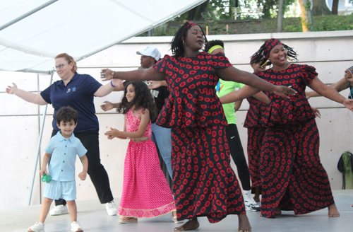 Audience dancing with Djapo Cultural Arts Institute drummers and dancers in Cleveland Cultural Gardens