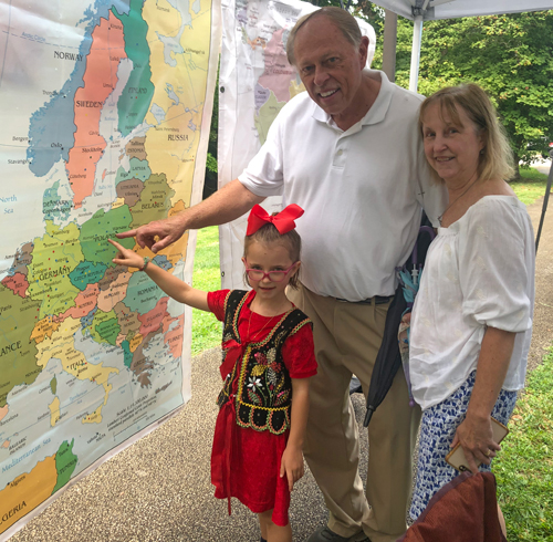 John Niedzialek and family pointing to Poland