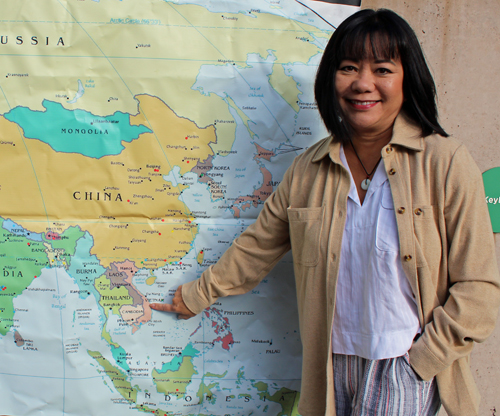 Oanh Loi-Powell pointing to Vietnam