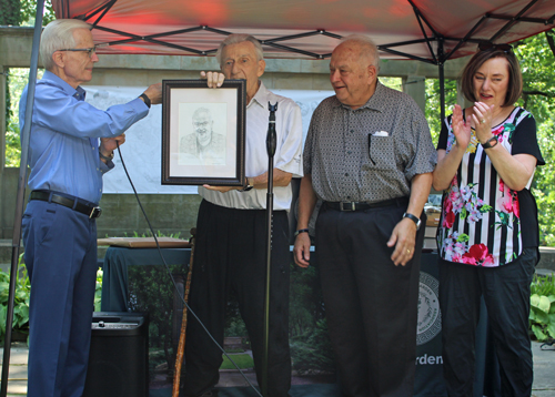 Ted Theodore presenting the picture to Lou Frangos