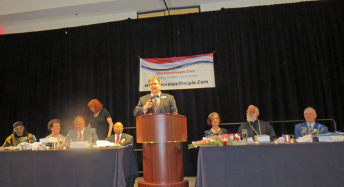 Dan Hanson speaking and the honorees