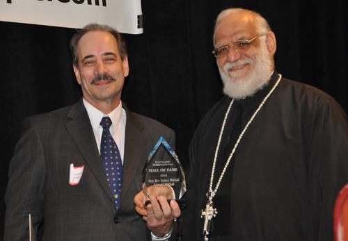 Seven Hills Mayor Richard DellAquila inducting Fr. Mikhail Mikhail into the Cleveland International Hall of Fame