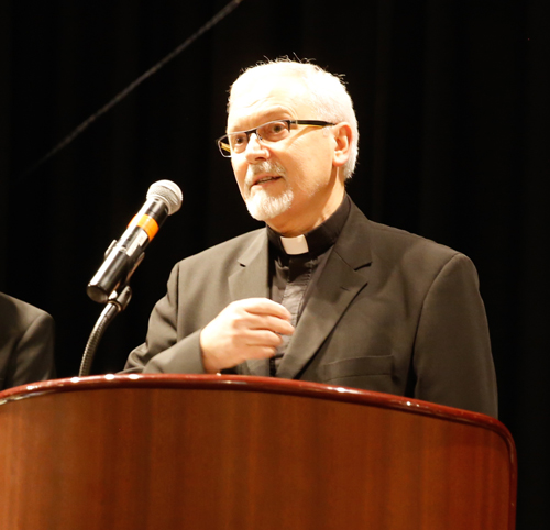 Father Remus Grama gave the invocation