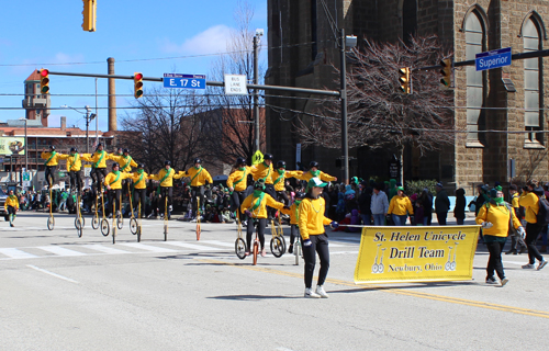 St Helens unicycles at 2025 Cleveland St Patrick's Day Parade