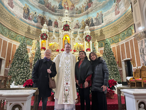 Cultural Garden reps Lori Ashyk, Qaisra Haider and Dozia Krislaty with Fr. Eric at St. Casimir Church