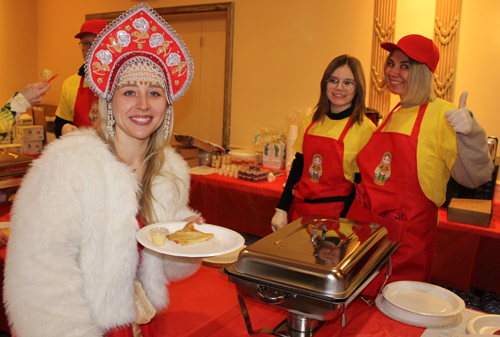 Maslenitsa volunteers serving food