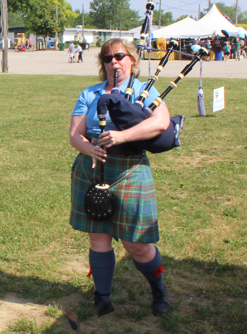 Woman playing bagpipes